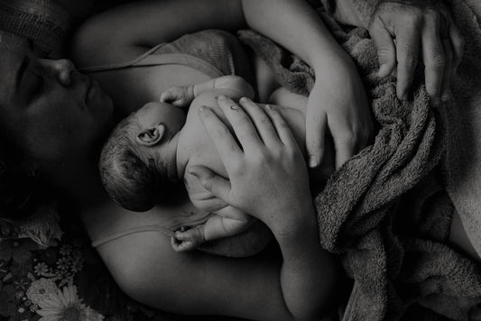 Newborn in mother's arms